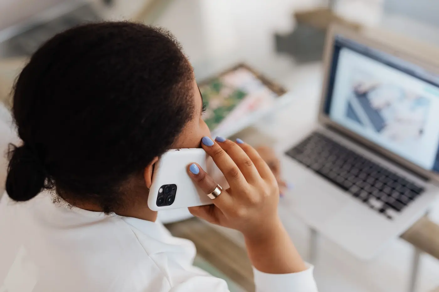 Loan officer reviewing mortgage applications on laptop